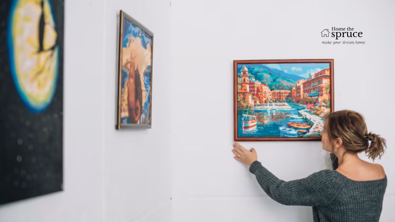 A photo of a line of framed art guiding viewers through a gallery.